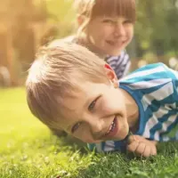 kids playing in green healthy grass