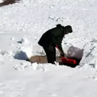 man shoveling snow