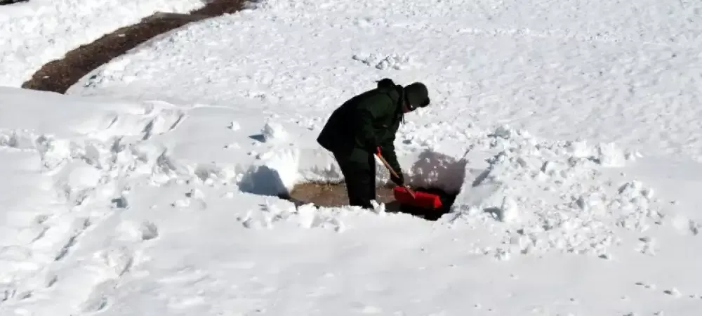 man shoveling snow