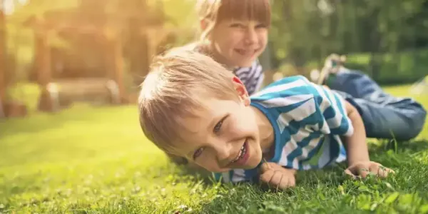 kids playing in green healthy grass