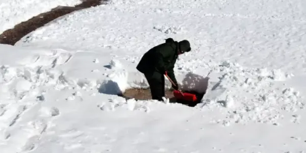 man shoveling snow