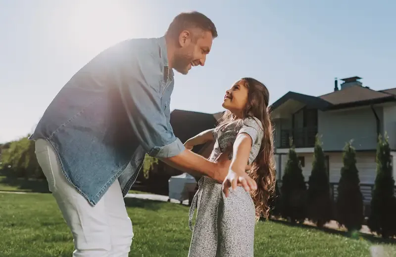 Father & daughter playing outside